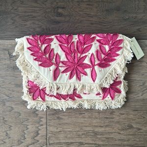 Canvas Embellished Frayed Clutch from Francesca’s.